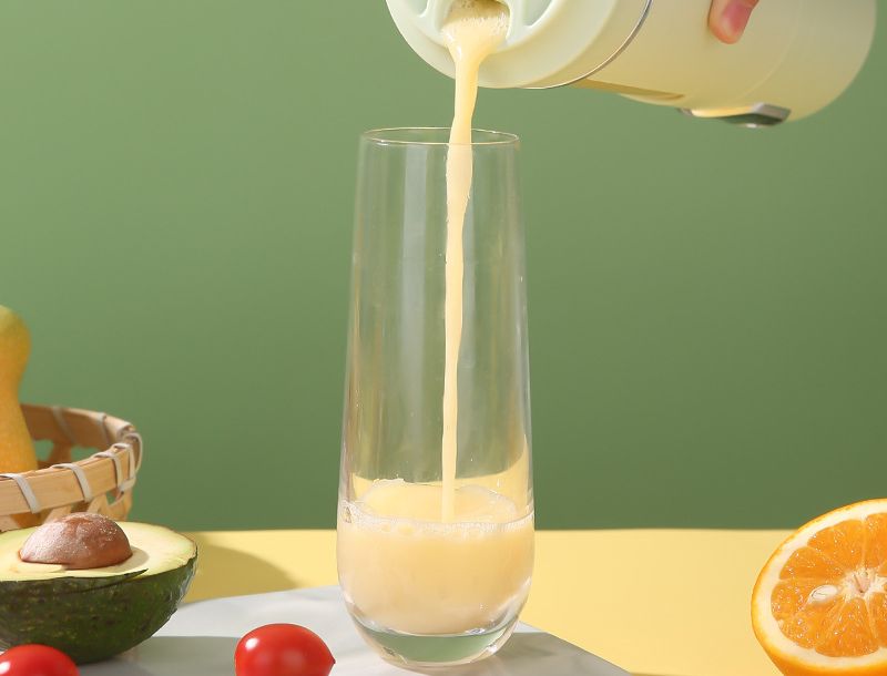 Fresh juice poured from the FlowMix Portable Blender